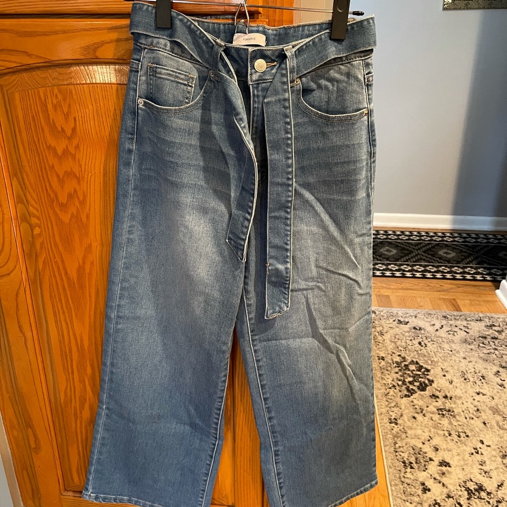 Never worn wide-legged, high waisted woman’s jeans, size 26